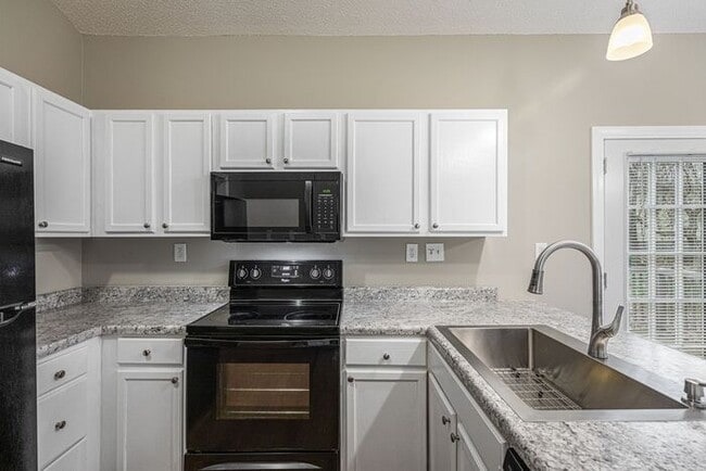 Building Photo - Like New Home off Freeman Mill. Just Painted, New Wood/Vinyl Flooring, Vaulted Ceilings, Front Po...