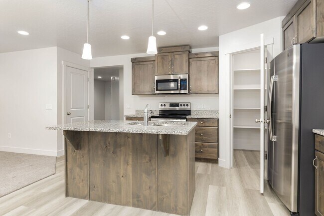 Building Photo - 3 bed | 2.5 bath | 2-car Townhome with Was...