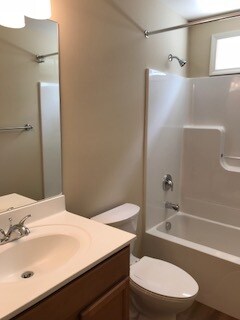 Full bath with counter height vanity, transom window for natural light, large mirror, even comes with curtain rod - 2312-A Belle Ave NE