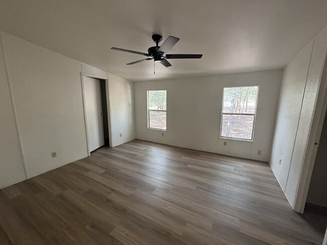 Building Photo - 3 bed 2 bath on one acre lot. New vinyl flooring throughout.