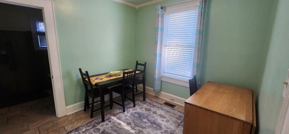 dining area + desk - 705 W Markham Ave