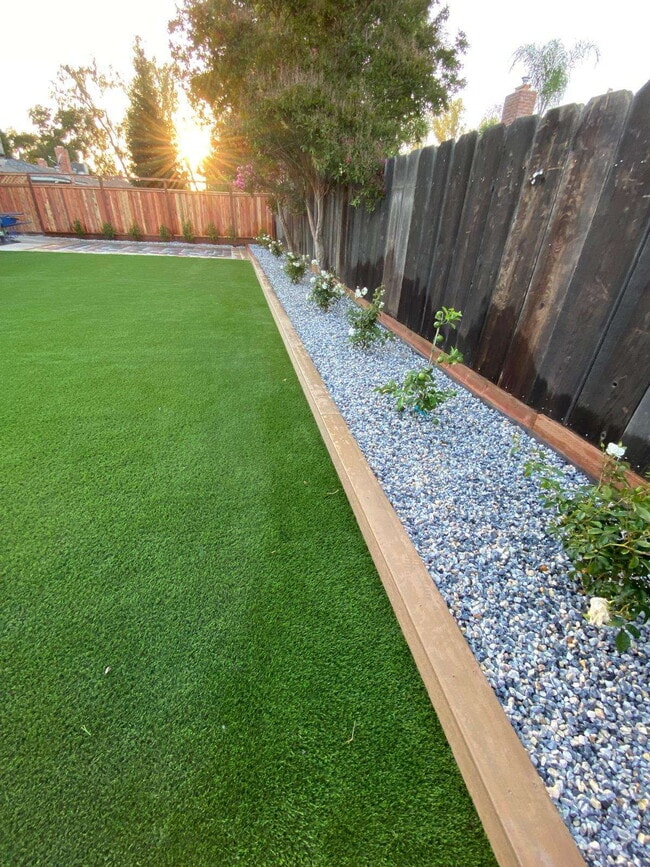 Building Photo - 4-bedroom, 2-bath home with solar, featuring a huge backyard and low-maintenance landscaping with...