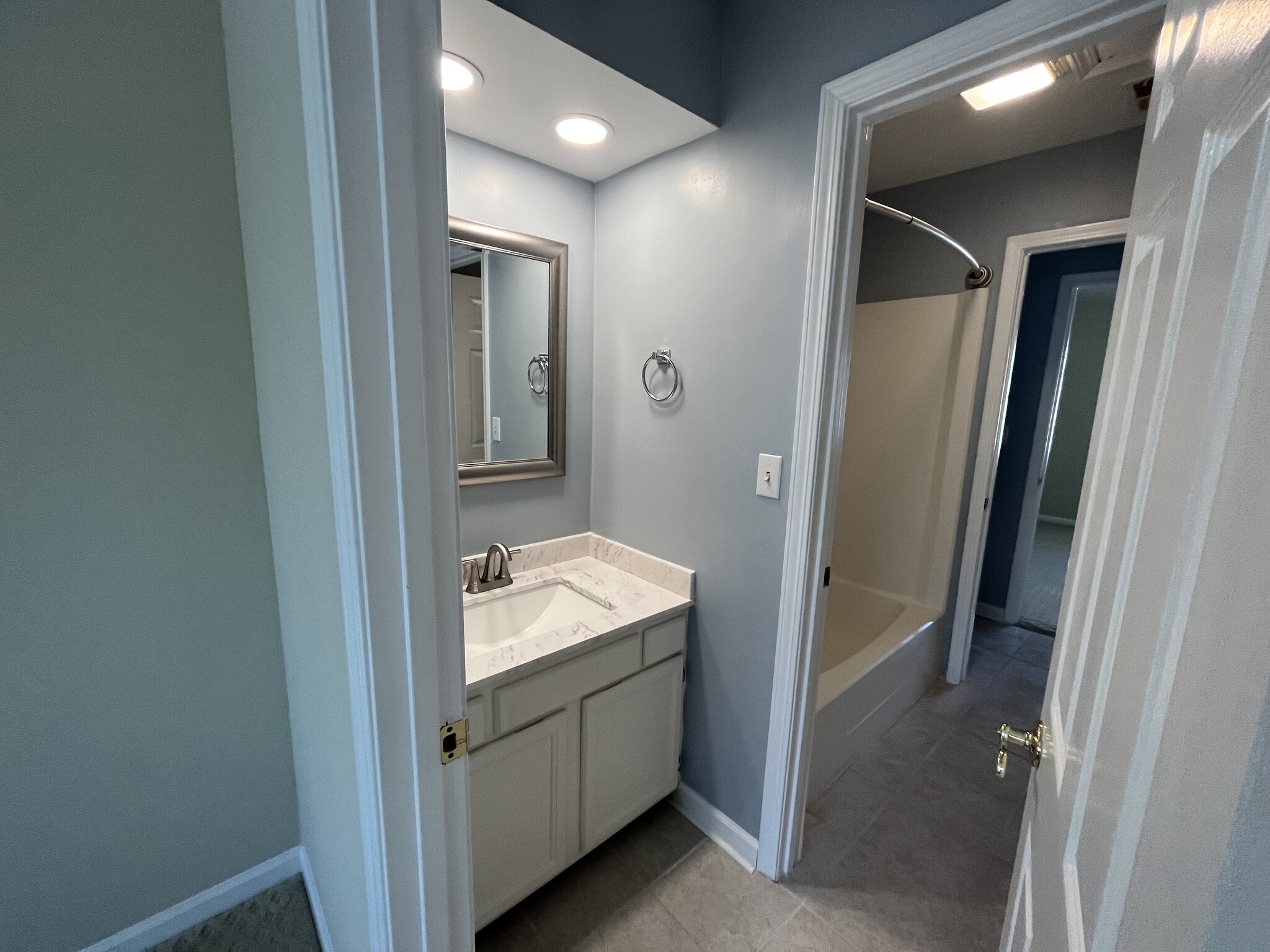 "His and Her" bathroom with shower/tub and two half baths - 830 44th Ave N