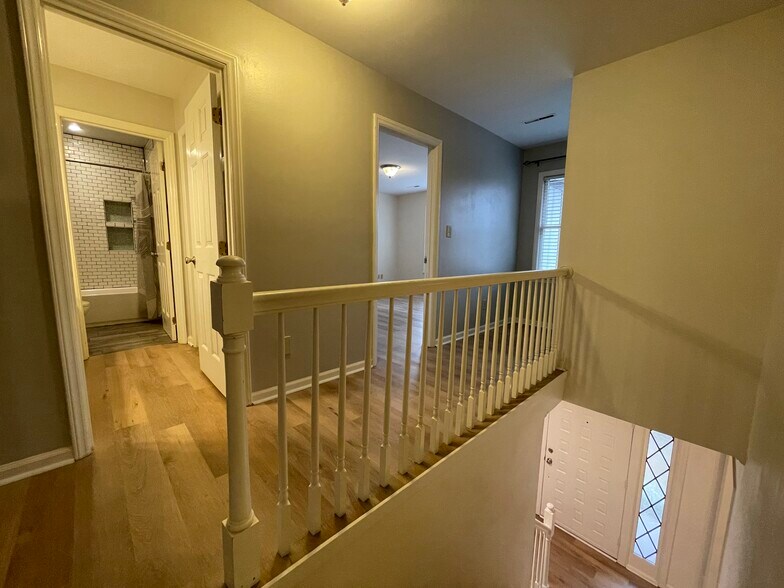 Top of stairs looking at bathroom and 2nd bedroom - 3 Tyrol Ct