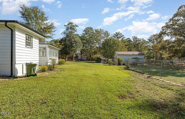 Building Photo - Charming Brick Ranch with Modern Elegance ...