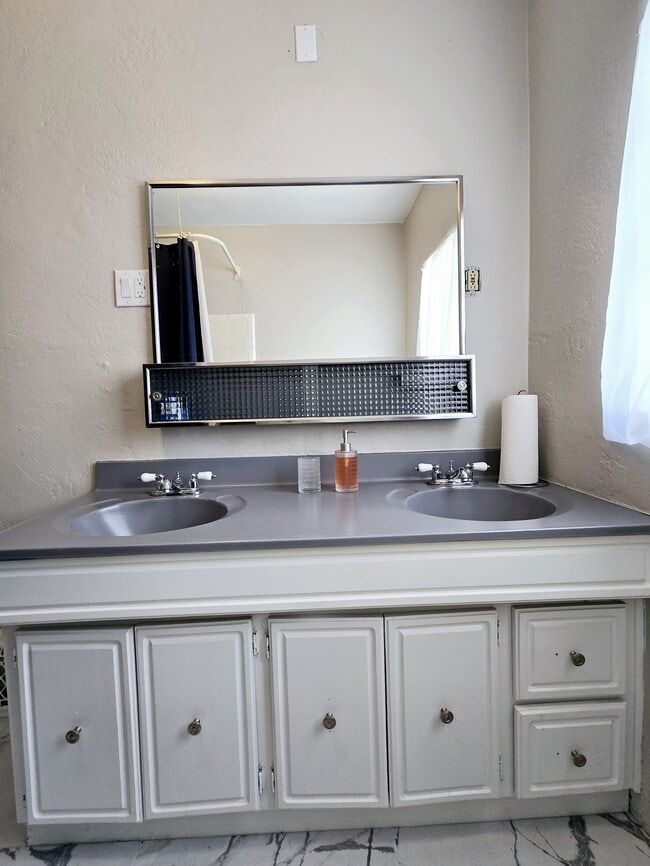 Bathroom with double vanity - 205 Harvard Dr SE