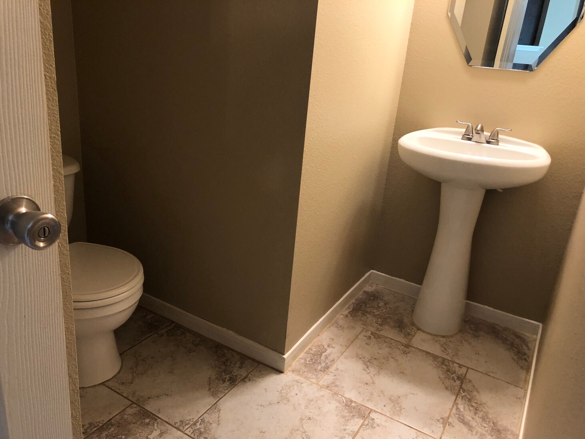 The half-bathroom downstairs. - 17359 Turquoise Stream Dr