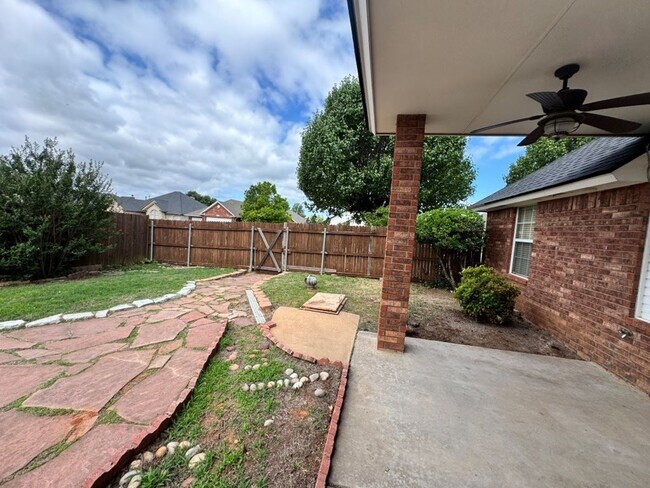 Building Photo - 4-bedroom 2 bath home in Kingsbrook, lots of storage, 2 dining areas and stand-up storm shelter! ...