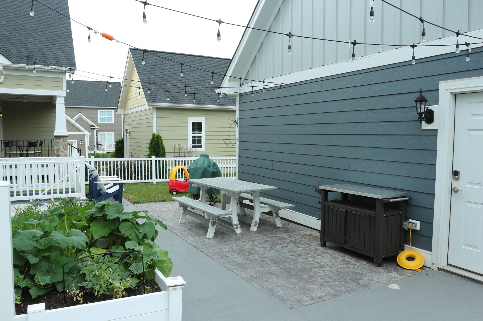 Large patio area for grilling and hanging out. Two large planters as well for your own vegetable garden. - 681 Fielding Run Dr