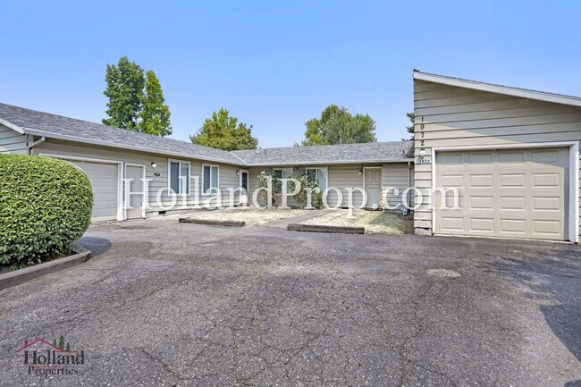 Building Photo - Charming 3-Bedroom Duplex with Fenced Yard, Fireplace & Garage Near Hwy 26!
