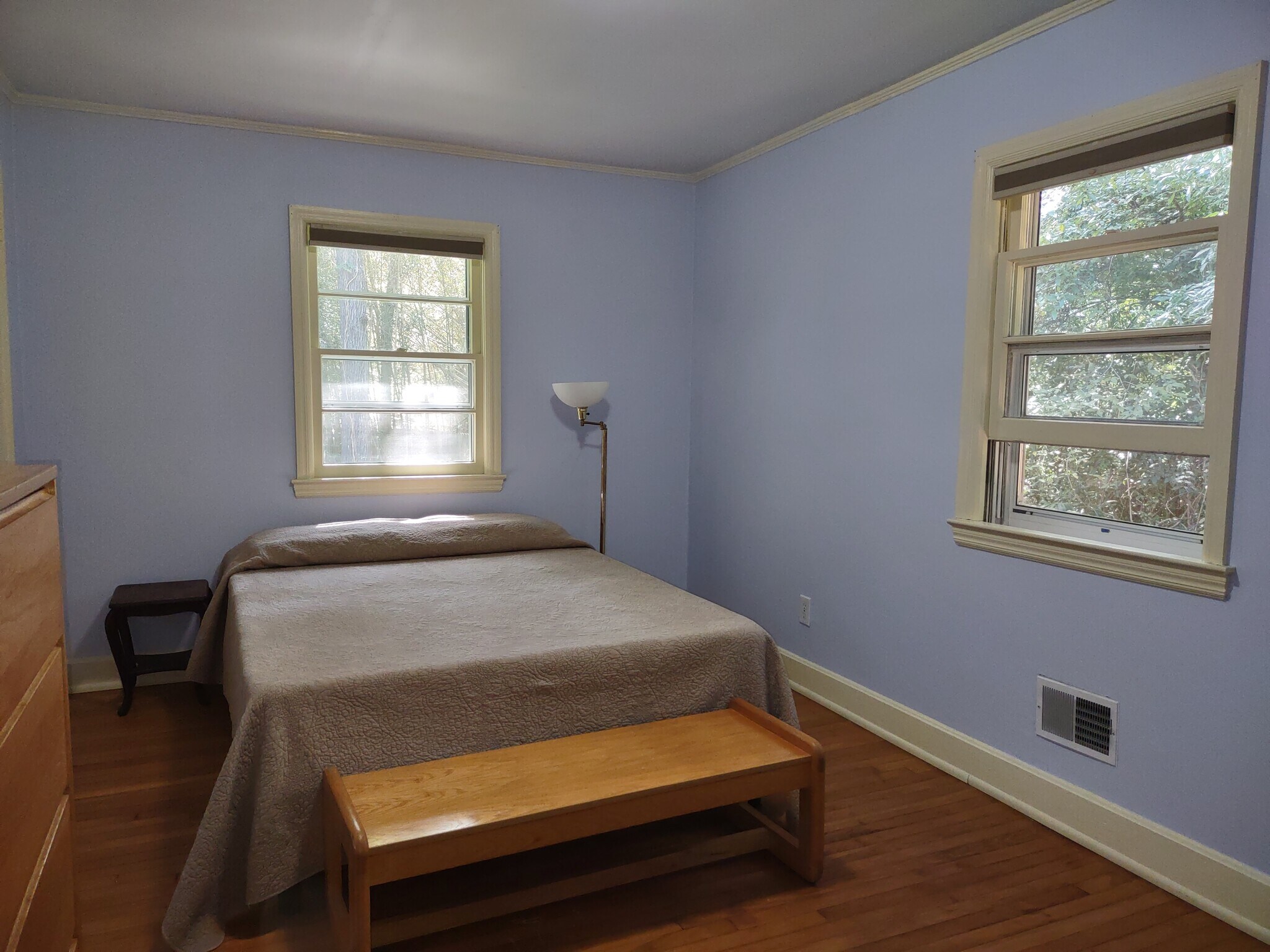Main bedroom has queen bed, dresser, end-of-bed bench, desk, chair, and room-darkening shades. - 223 Barclay Road