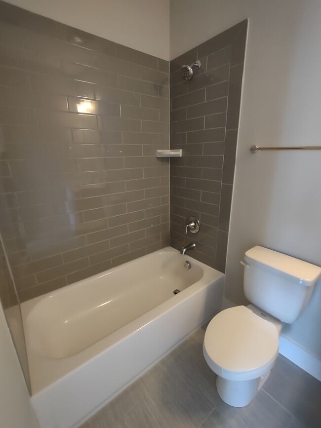 Building Photo - Pristine, move in ready Townhome located i...