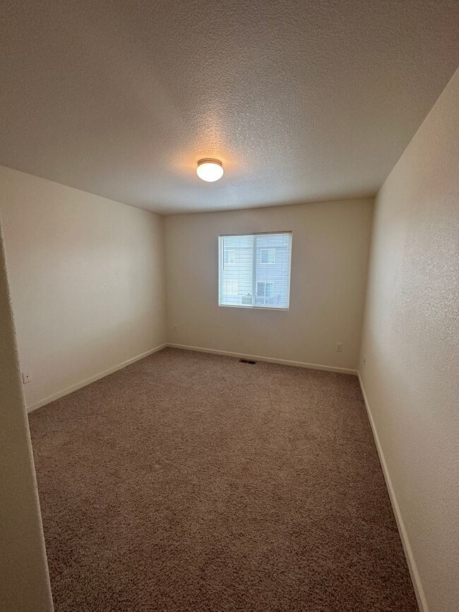 Building Photo - 3 BEDROOM, 2.5 BATHROOM TWINHOME WITH 2 CAR ATTACHED GARAGE