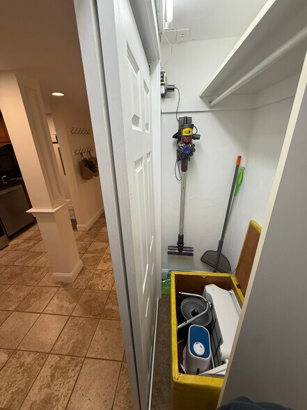 kitchen closet - vacuum, swiffer, broom, fan, air purifer, and humidifier available - 382 Riverway St