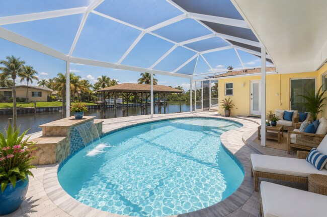 Building Photo - Live the ultimate Space Coast waterfront lifestyle at this stunning beachside canal home in Satel...