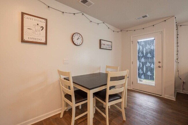 Building Photo - Partially furnished and now available!