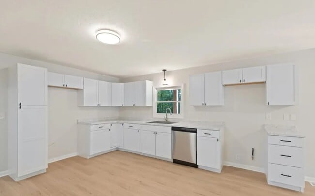 All kitchens have been renovated with modern cabinets and stainless appliances - 6362 E County Road 200 N