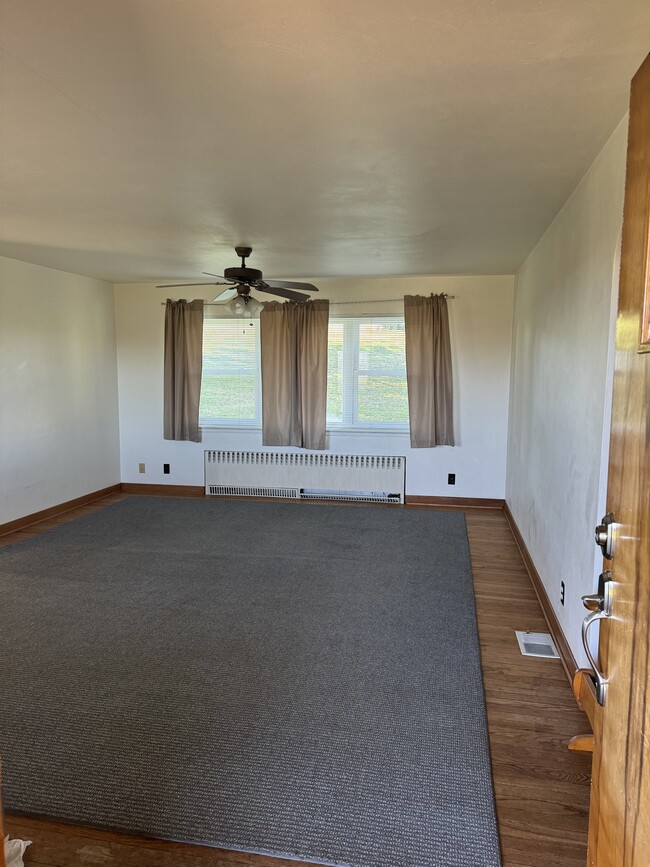 Original Hardwood Flooring - very cozy living room with padded carpet overlay - 620 Horn Rd