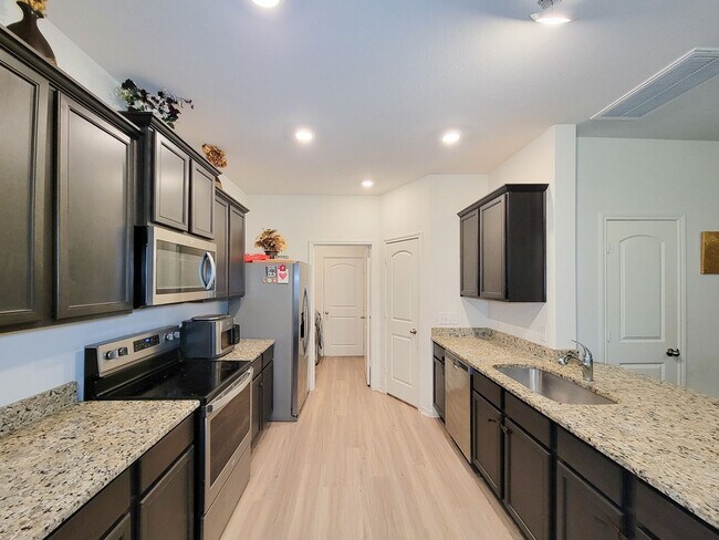 Building Photo - This home is a thoughtfully designed home offering comfort, space, and modern upgrades throughout...