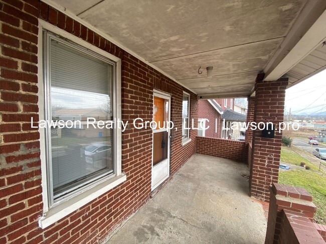 Building Photo - Updated Three Bedroom with Flat Yard