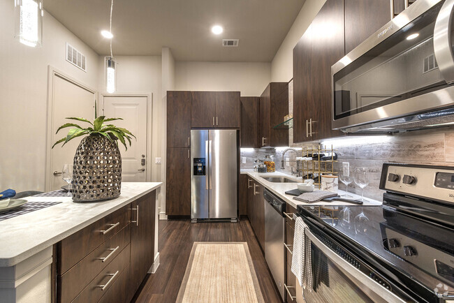 Our modern kitchens are designed with the home chef in mind, featuring stainless steel appliances - Windsor Turtle Creek