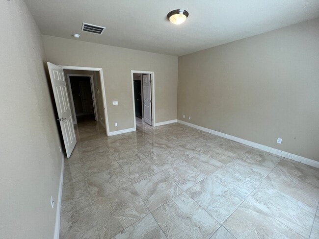 Building Photo - A Fantastic 4 Bedroom Home with the primary Downstairs, in Silverado Ranch