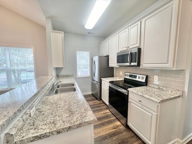 Building Photo - **OFFERING RENT PROMOTION FOR FIRST 6 MONTHS** Newly Remodeled 2BD, 2BA Corner Lot Raleigh Townho...