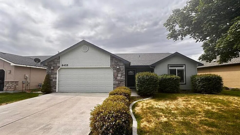 Front of house with a common area in the back - 8455 W Harmonica Way