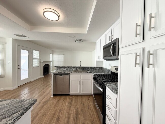 Building Photo - Corner Lot Beauty with Open Living, Guest Suite Down & Expansive Backyard