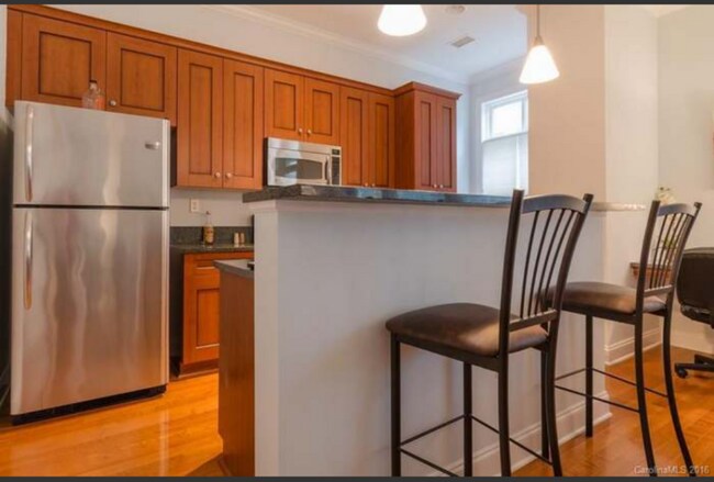 Kitchen and breakfast isle - 230 S Tryon St