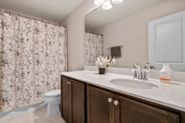 Building Photo - Water Front Home- 4 Large Bedrooms-3 baths Gated Community Call Sheila Campbell 407-687-7900
