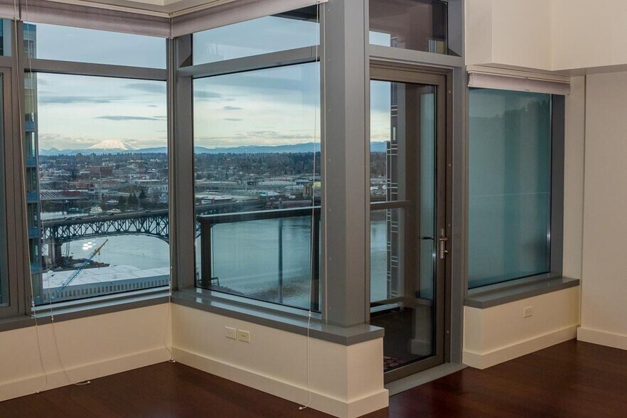 22nd floor with large windows and balcony with a view of the river, bridge, OHSU, and Mt. St. Helens. - 3601 SW River Pkwy