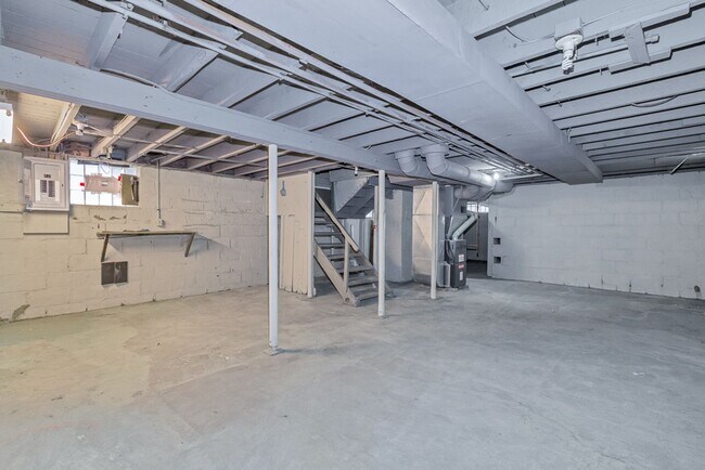 Building Photo - Charming 3BR Home with Classic Woodwork, Porch & Bonus Attic Space