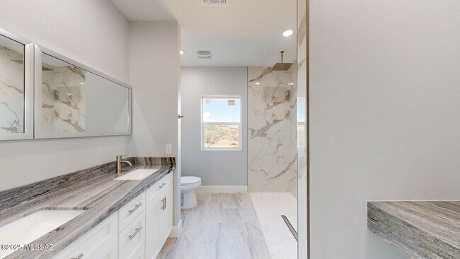 Building Photo - 7095 W Los Reales Rd