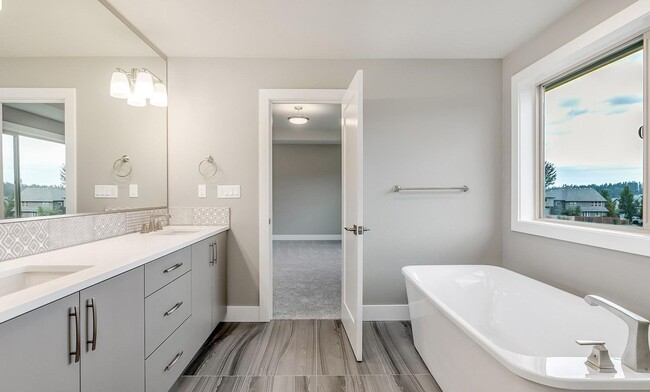 Building Photo - Bethany Stunner - 5 Bedrooms with Main-Level Bed & Bath, Modern Kitchen & Private Fenced Yard