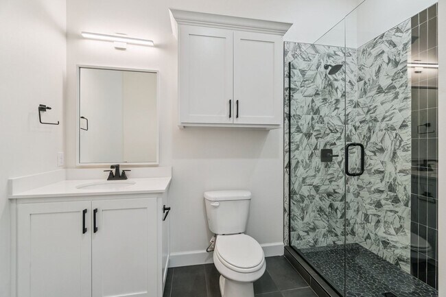 Building Photo - Bright. Clean. Calm. Your Elevated One-Bed...