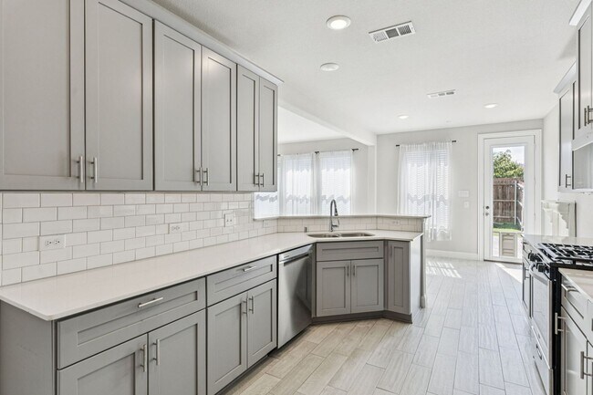 Building Photo - Discover Elevated Living at Normandy Village