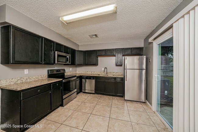 Building Photo - 7500 Coquina Ave