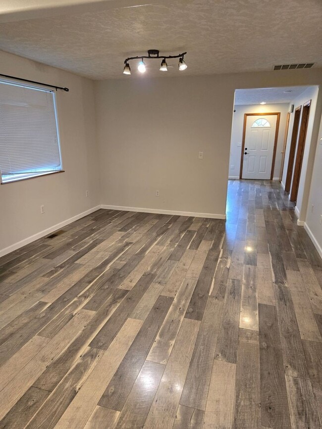 Building Photo - Large lot with tons of storage !  3 br , 2 bth + office+ 2  Car-garage + 2 Wooden Sheds