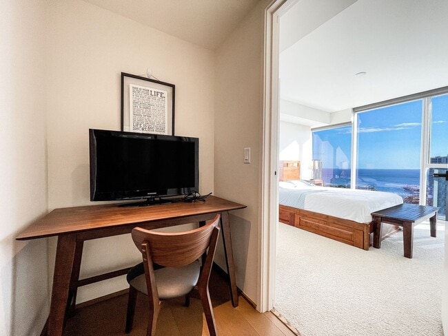 Building Photo - Furnished Symphony Condo with Direct Ocean Views and Two Parking