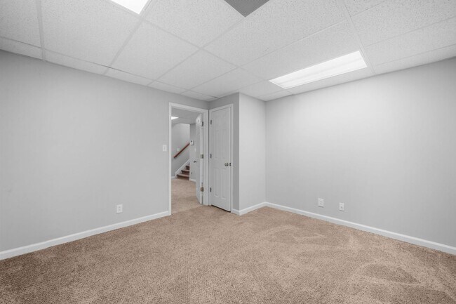 Building Photo - Stunning Stone Fireplace • Finished Basement • Fenced Yard