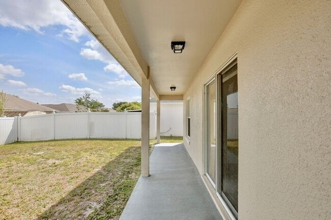 Building Photo - Beautiful 3/2 Spacious Home with a covered patio and a 2 Car Garage in Villa Homes Village - St C...