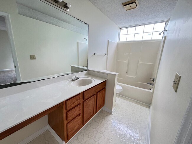 Building Photo - First Floor, Unfurnished, 3 Bedroom, 2 Bath Condo with Screened-in Back Patio!