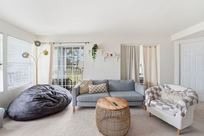 Building Photo - Bathed in natural light, this stunning second level condominium offers an effortless blend of com...