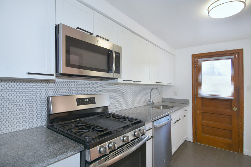Kitchen has new LED ceiling lighting with access to large backyard and patio - 31 Marylea Ave