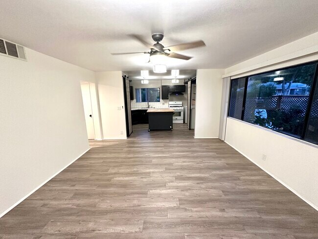 Transition from living room to kitchen space. - 5303 Alhama Dr