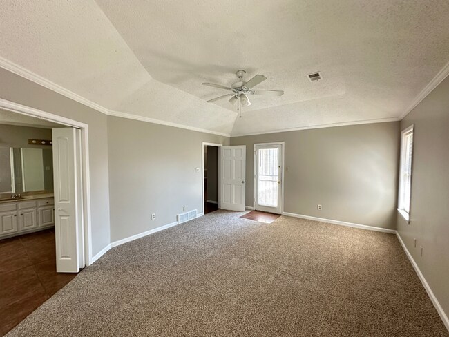 Building Photo - Grand 4BR/2BA Near Southwind | 2,438 Sq Ft, Stone Fireplace, Soaking Tub & 2-Car Garage