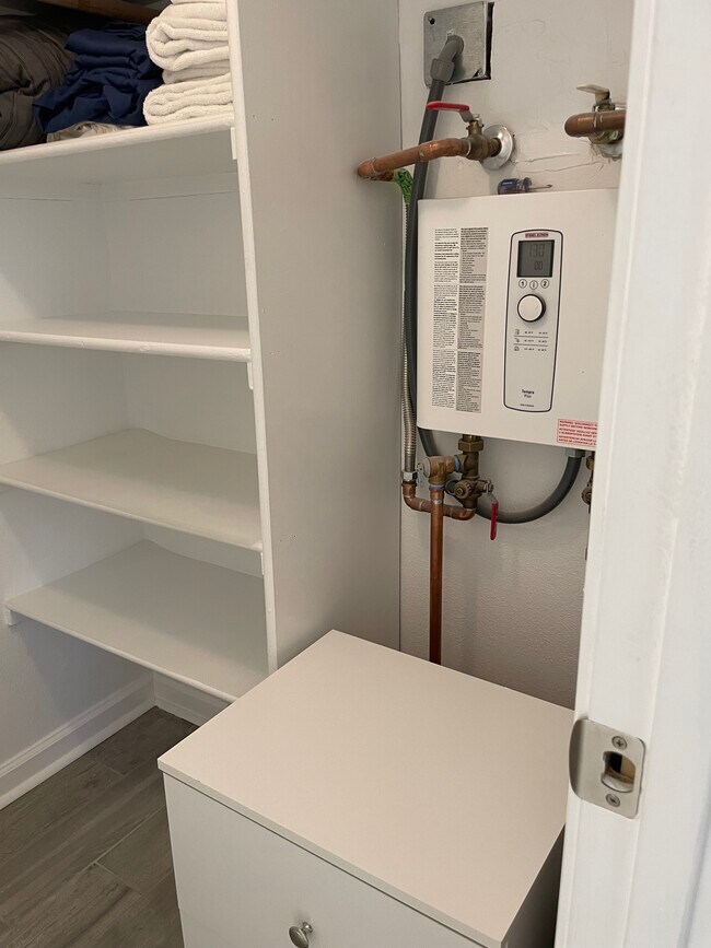 Closet with tankless hot water heater - 1810 E Blacklidge Dr