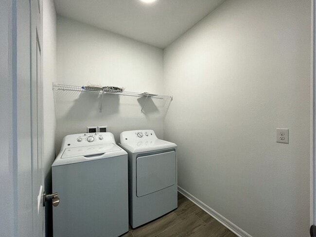 Building Photo - Townhome with garage, excellent location, community pool and more