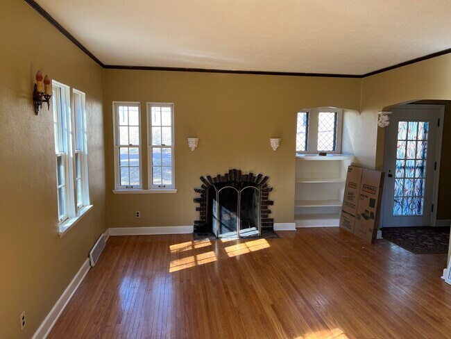 Main level living room with FP. - 27 S Riverview Hts